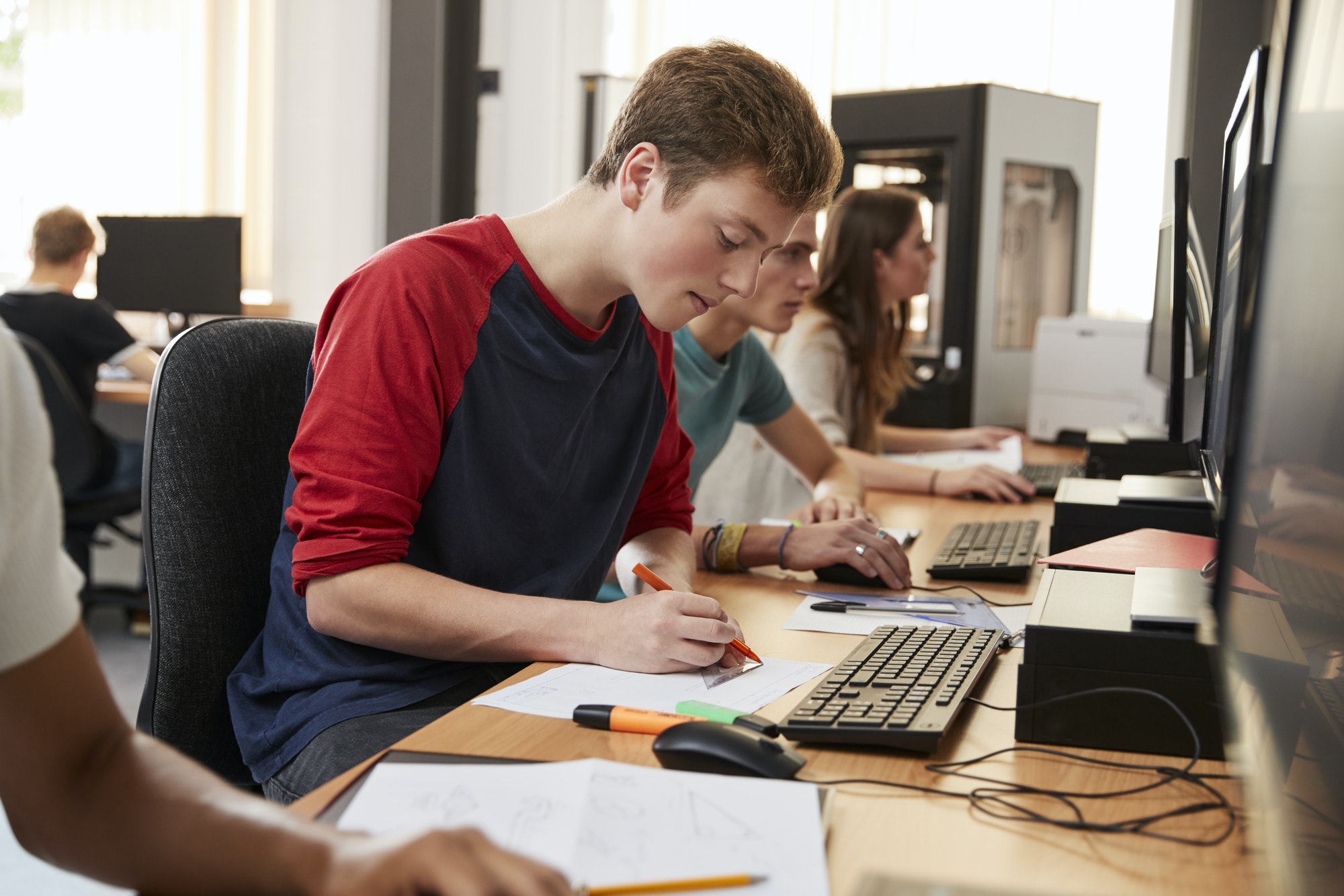 Design Students Working On Computers In CAD/3D Printing Lab