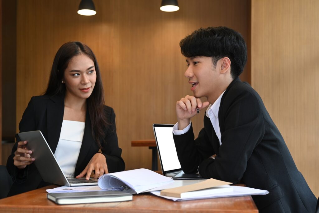 Group of human resources departments working together in modern office.